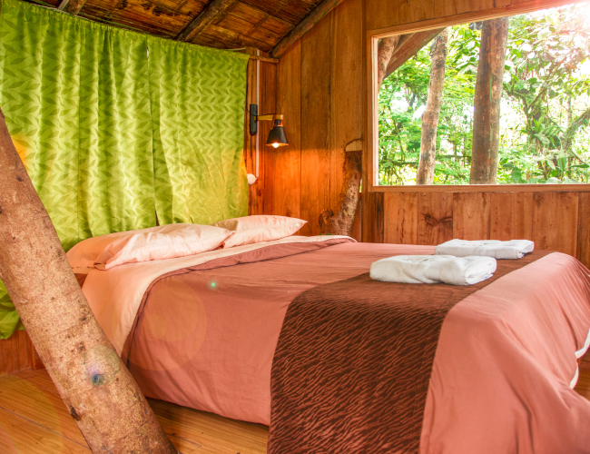 A rustic hotel bedroom in a tree house hotel